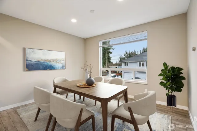 a dining room with furniture and window