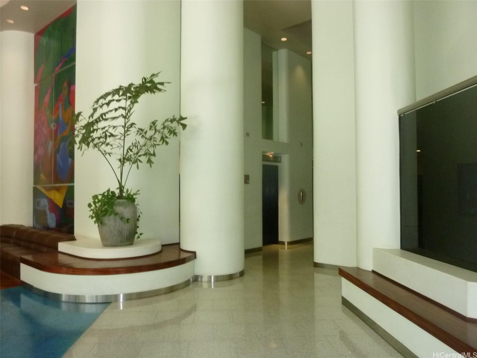 700 Richards Street, Unit 703 Honolulu, HI 96813 - Photo 12 of 12 a vase of flowers sitting on a table