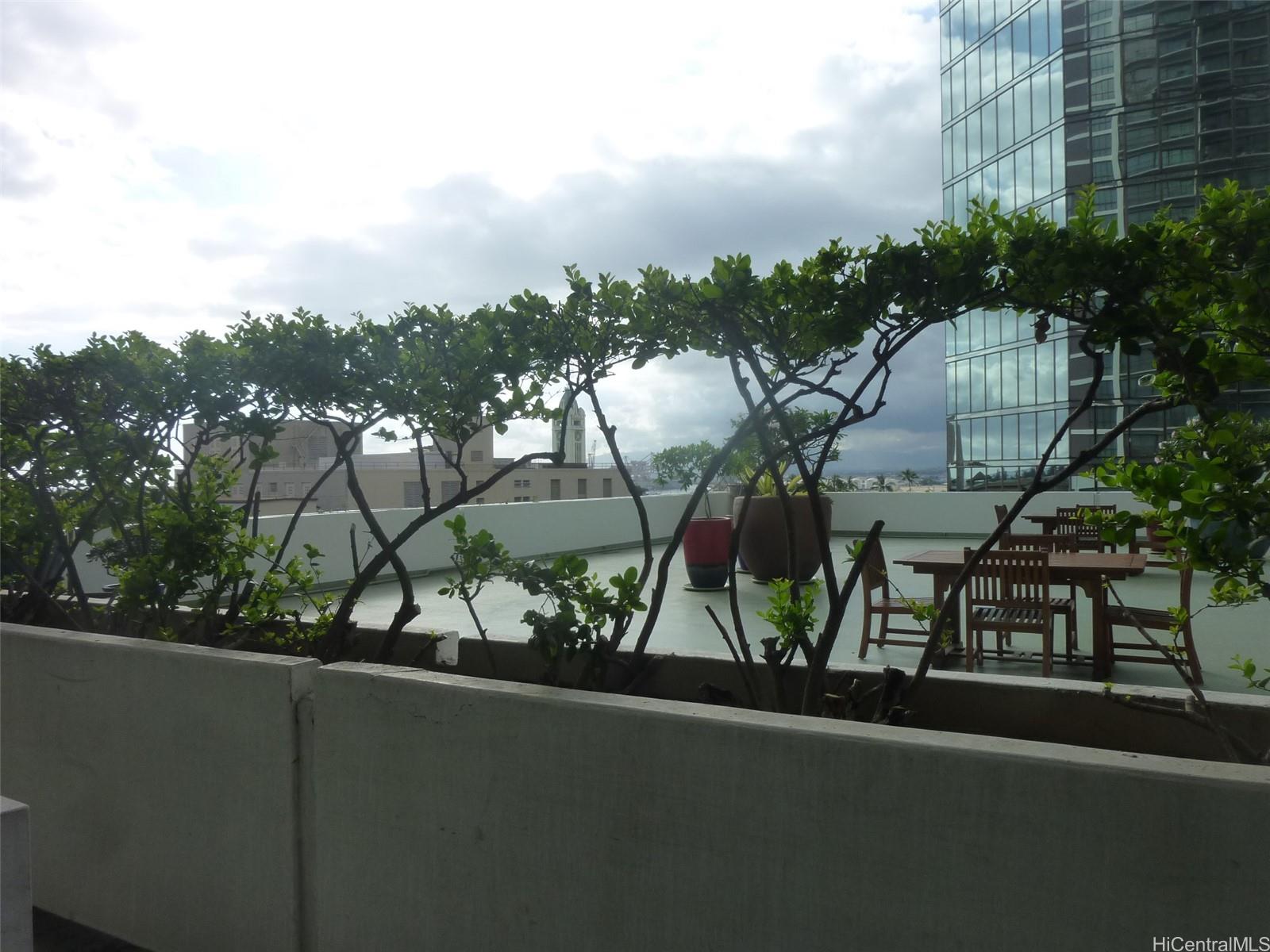 700 Richards Street, Unit 703 Honolulu, HI 96813 - Photo 7 of 12 a view of a balcony with plants