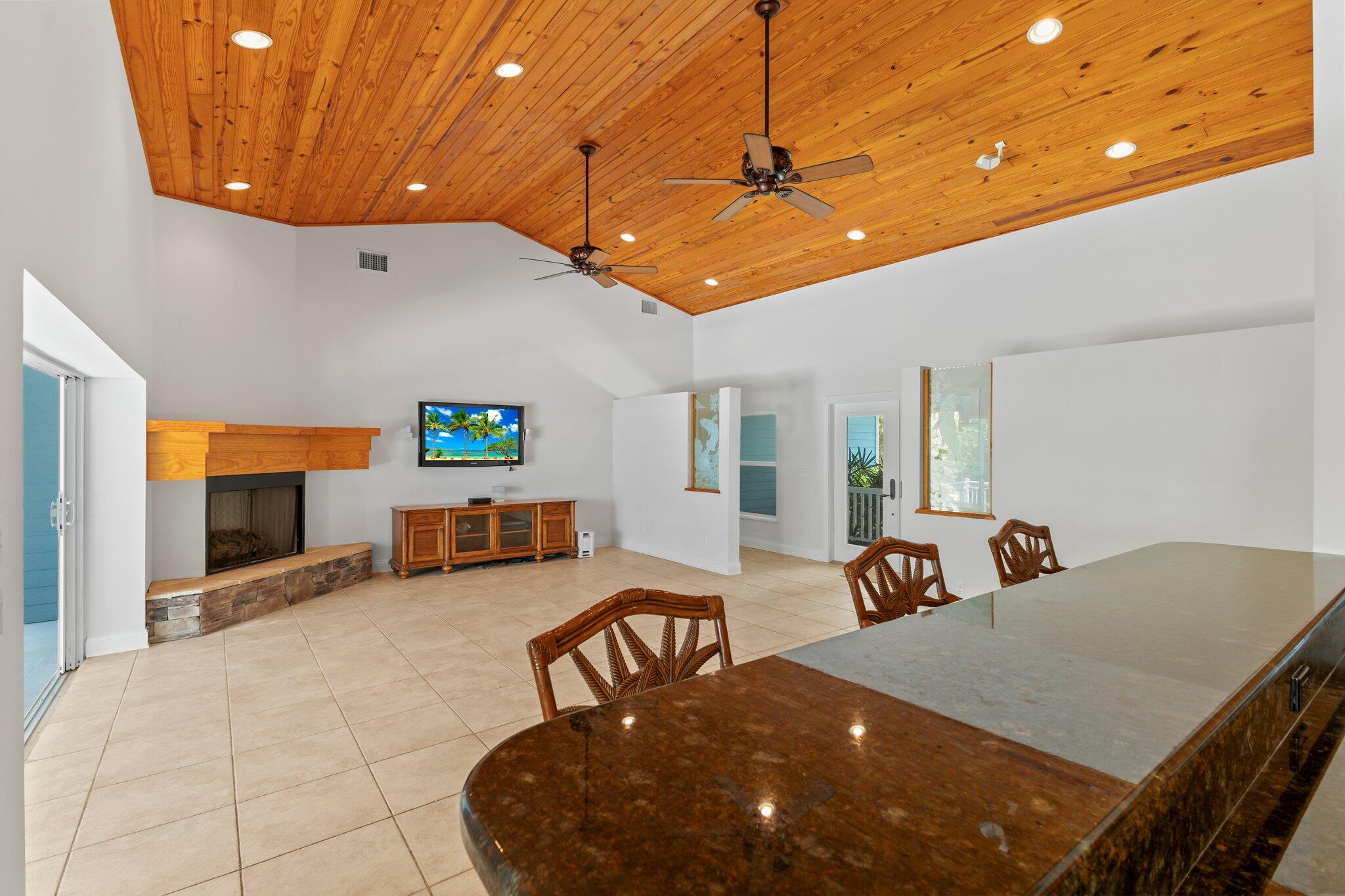 1293 Southwest Heather Terrace Stuart, FL 34997 - Photo 15 of 80 a living room with furniture and a flat screen tv