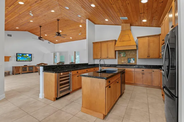 a dining room with furniture and a floor to ceiling window
