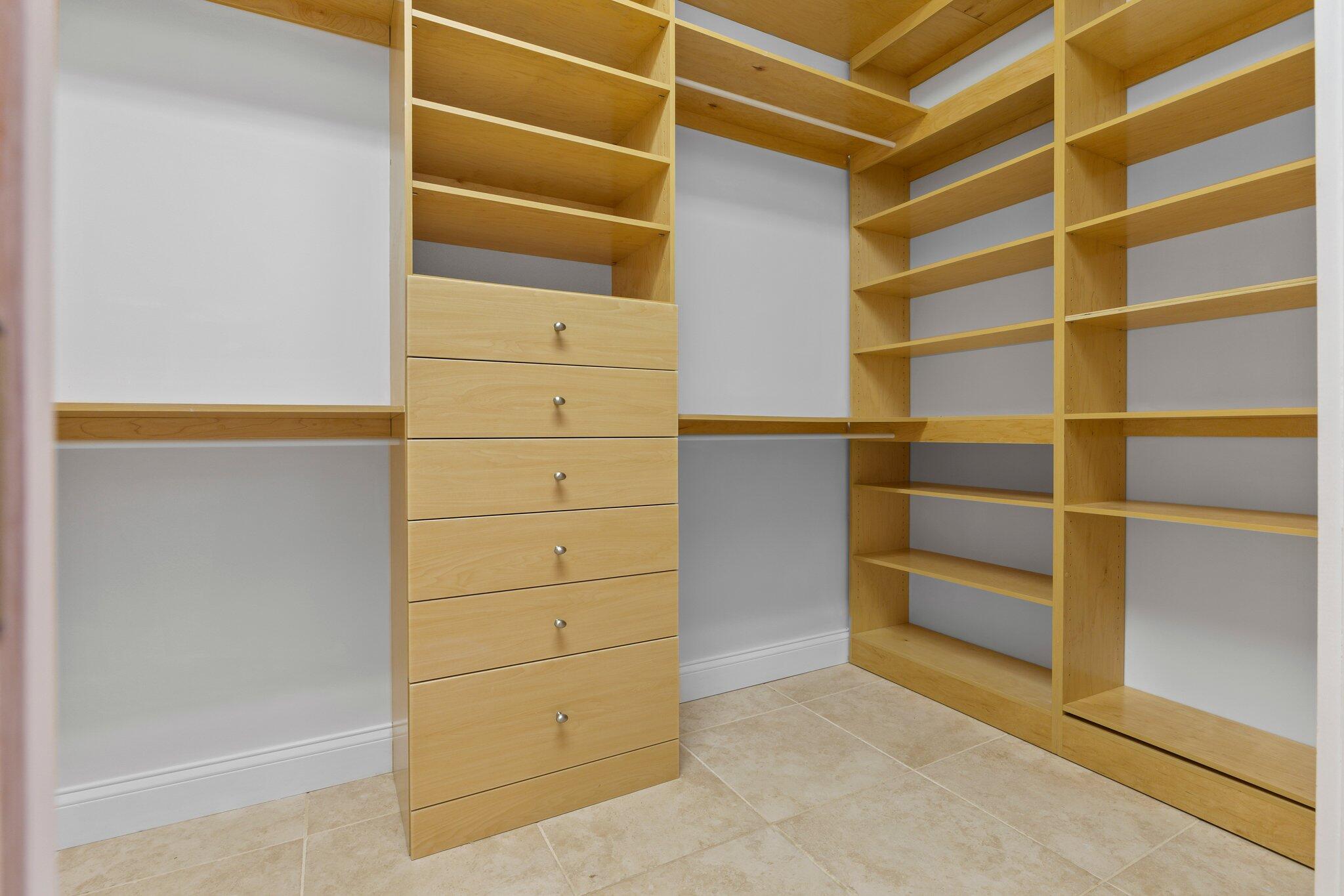 1293 Southwest Heather Terrace Stuart, FL 34997 - Photo 25 of 80 a view of walk in closet with empty racks