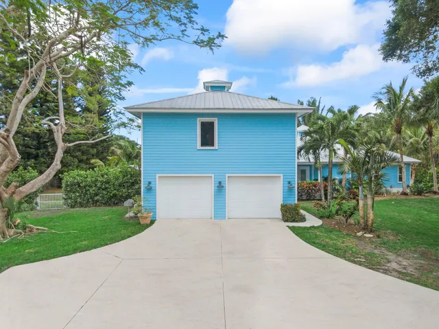 a view of an empty room with a staircase