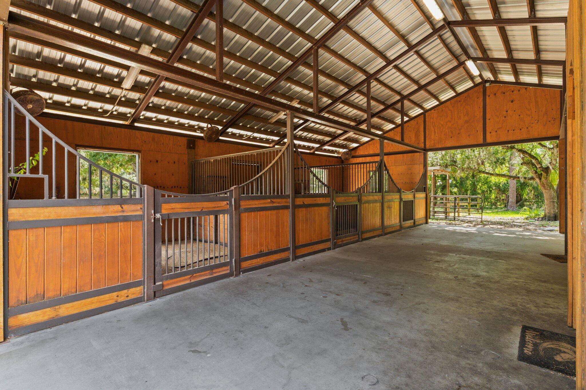1293 Southwest Heather Terrace Stuart, FL 34997 - Photo 75 of 80 a view of an empty room with a staircase