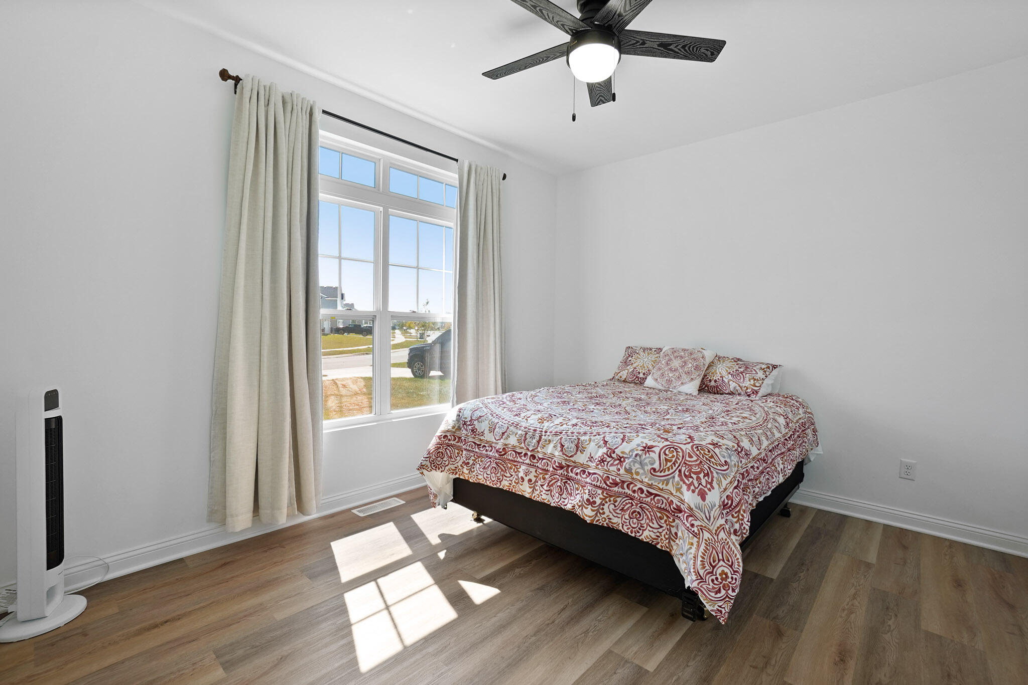 8772 Potomac Way Lowell, IN 46356 - Photo 12 of 30 a bedroom with a bed and a window