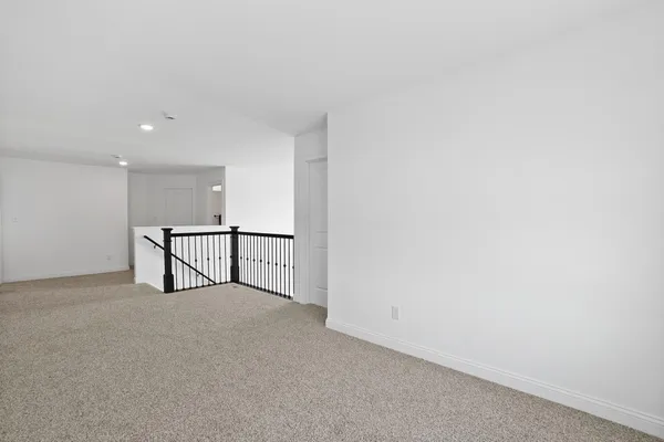 a bedroom with a bed and a mirror