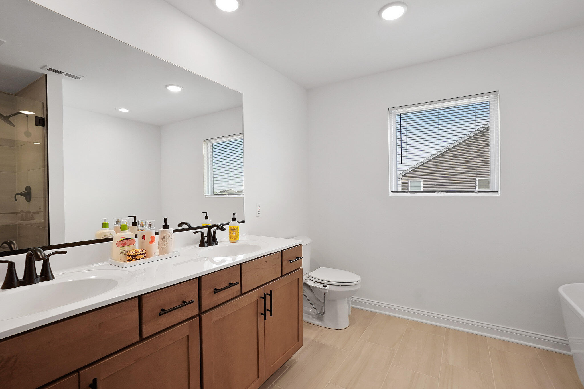 8772 Potomac Way Lowell, IN 46356 - Photo 20 of 30 a bathroom with a toilet sink and mirror