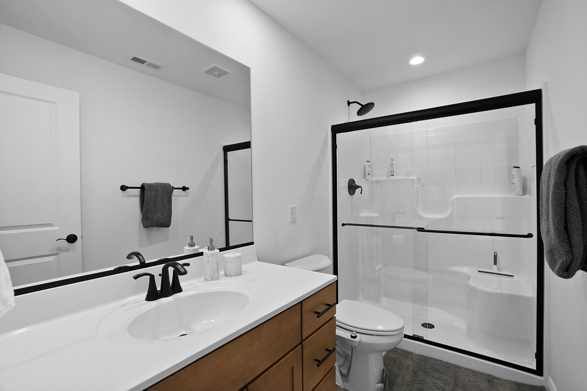 8772 Potomac Way Lowell, IN 46356 - Photo 24 of 30 a bathroom with a sink toilet and mirror