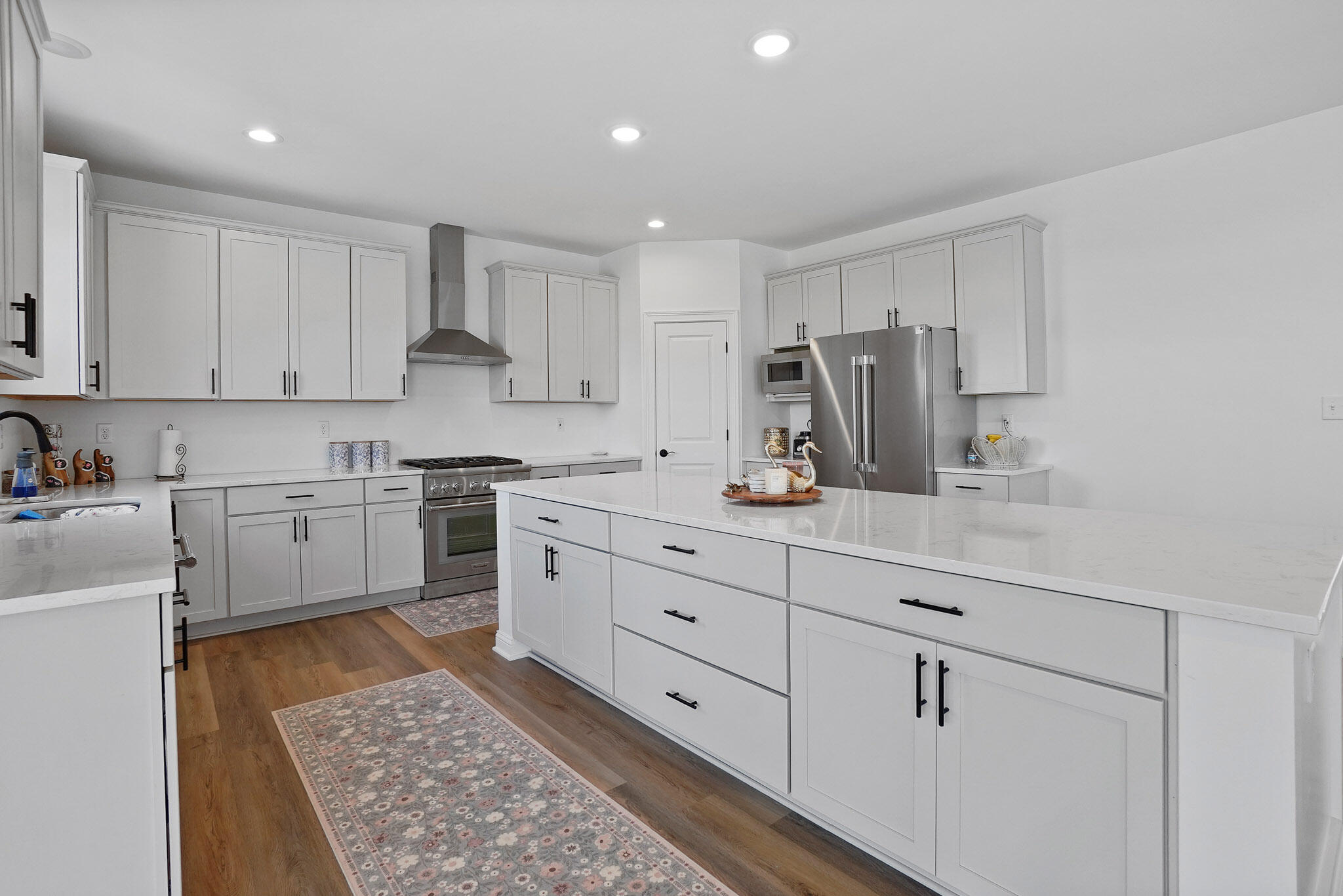 8772 Potomac Way Lowell, IN 46356 - Photo 10 of 30 a kitchen with white cabinets and white appliances