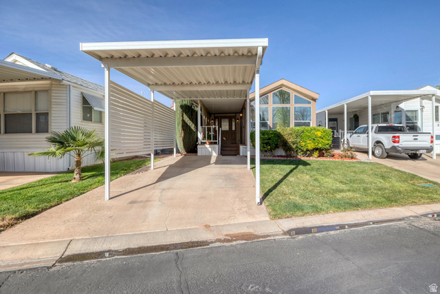 2990 East Riverside Drive, Unit 58 St. George, UT 84790 - Photo 23 of 31 Front of home, covered carport