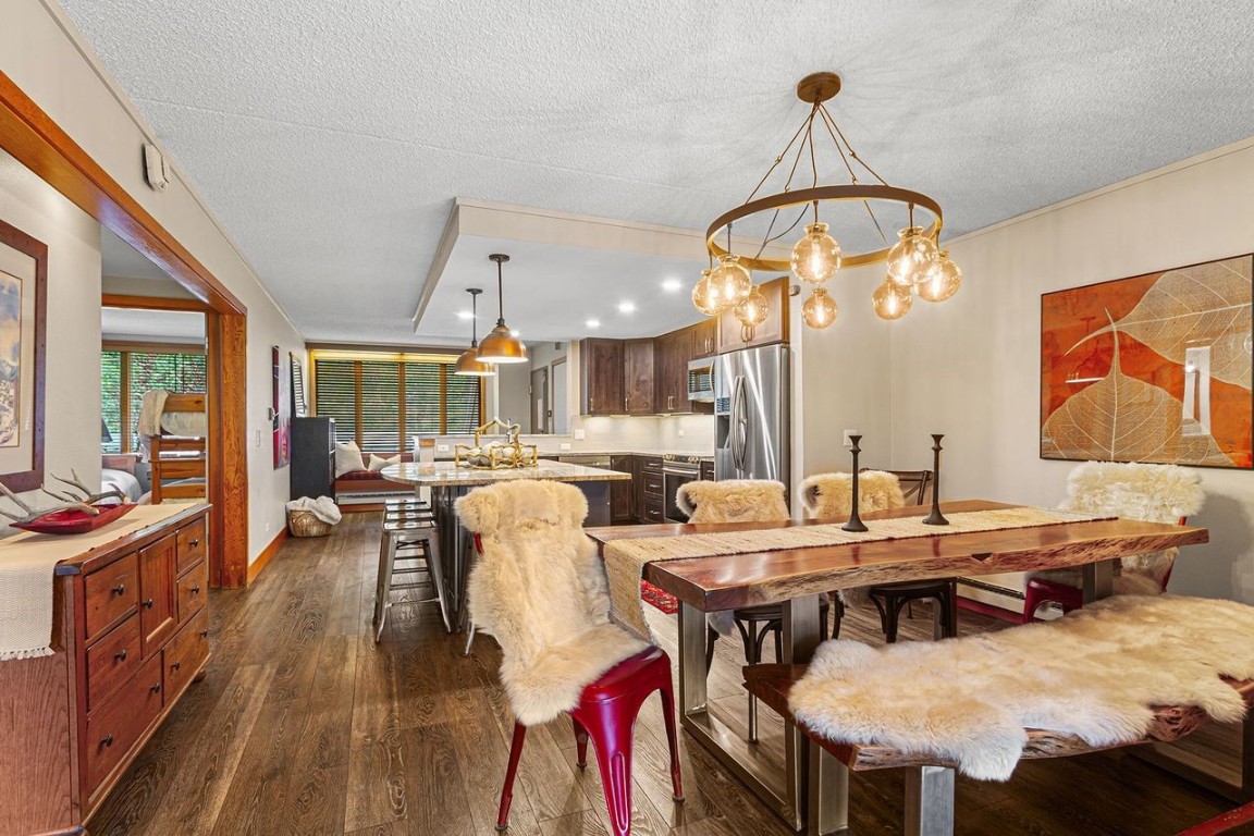 21650 Highway 6, Unit 2110 Keystone, CO 80435 - Photo 12 of 26 a view of a dining room with furniture window and outside view