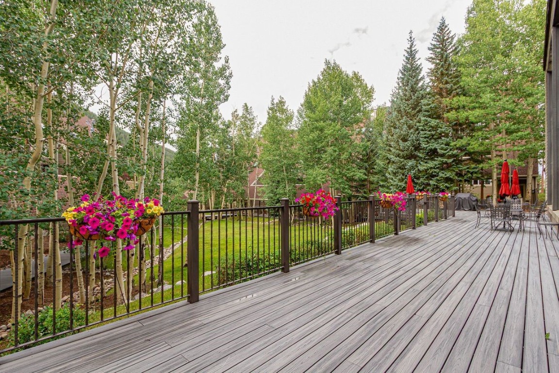 21650 Highway 6, Unit 2110 Keystone, CO 80435 - Photo 21 of 26 a view of a house with a deck and flowers