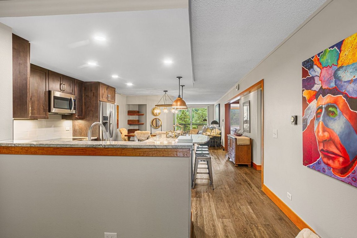 21650 Highway 6, Unit 2110 Keystone, CO 80435 - Photo 8 of 26 a living room with furniture and a flat screen tv