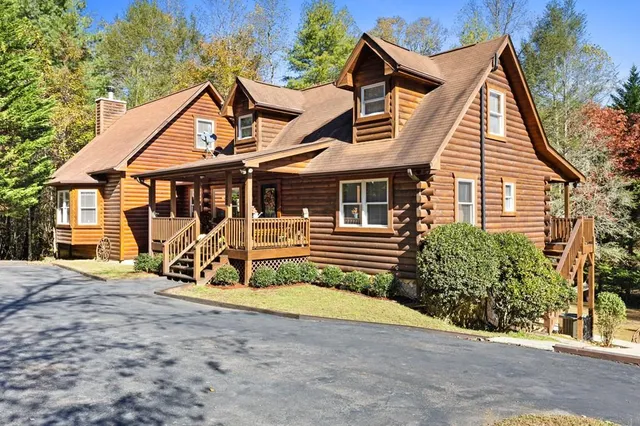 a view of a house with wooden fence