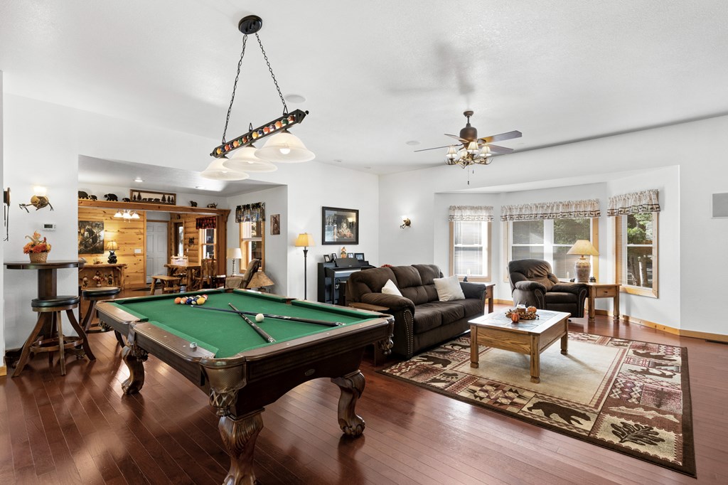 358 Misty River Circle Murphy, NC 28906 - Photo 12 of 62 a living room with patio furniture and a wooden floor