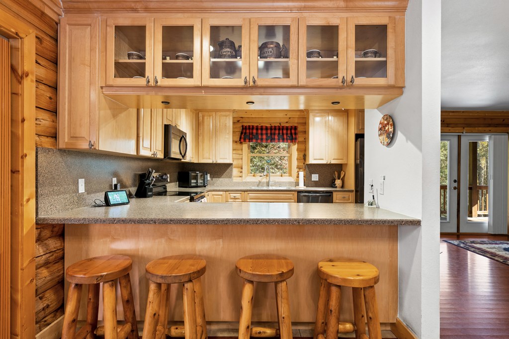 358 Misty River Circle Murphy, NC 28906 - Photo 16 of 62 a kitchen with a sink cabinets and dining table chair