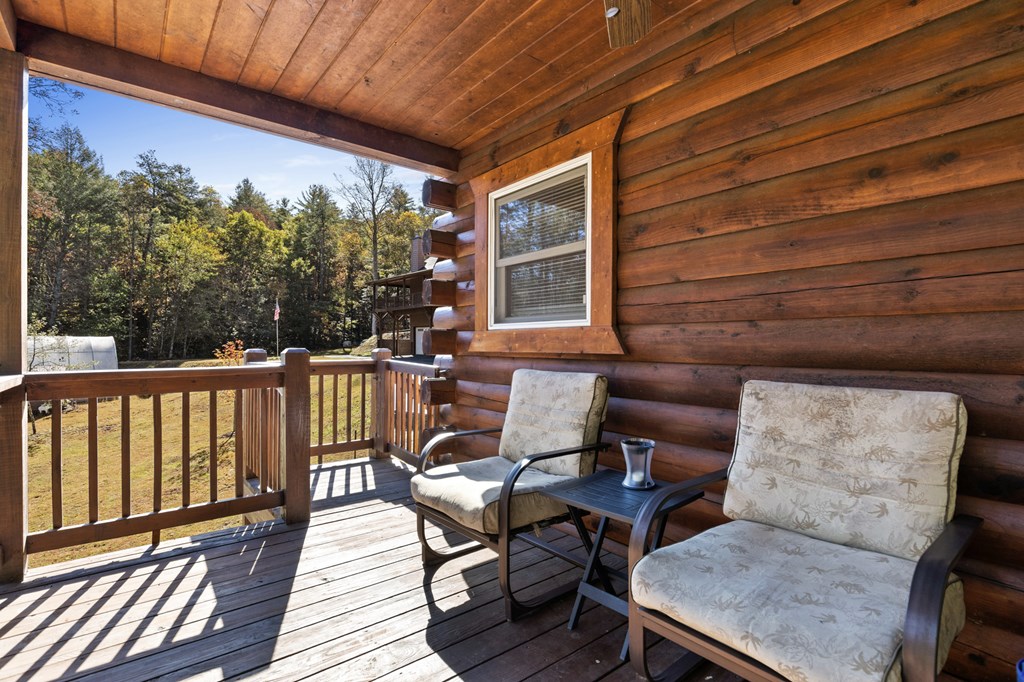 358 Misty River Circle Murphy, NC 28906 - Photo 23 of 62 a balcony with furniture and wooden floor