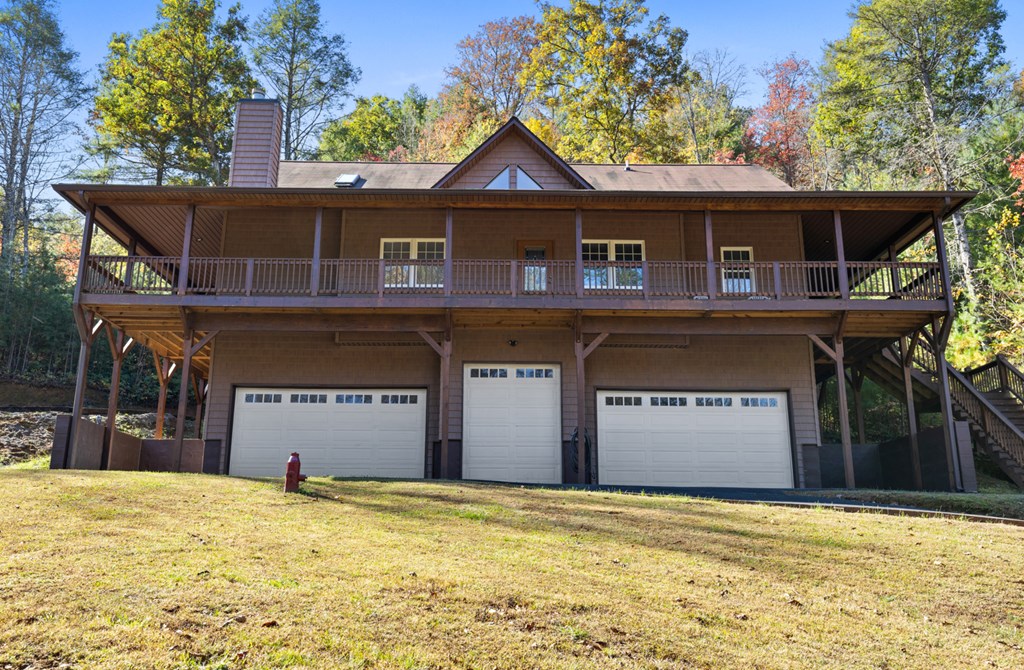 358 Misty River Circle Murphy, NC 28906 - Photo 43 of 62 a front view of a house with a yard and garage