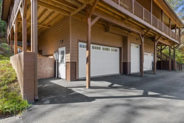a bedroom with a bed and a baby crib