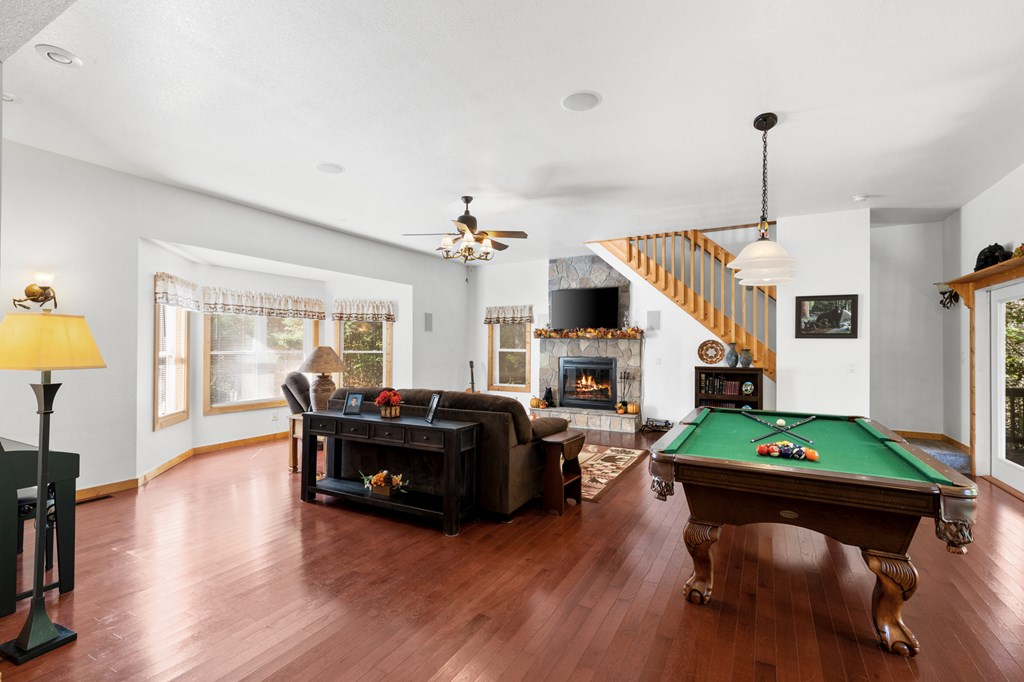 358 Misty River Circle Murphy, NC 28906 - Photo 10 of 62 a living room with fireplace furniture and a wooden floor