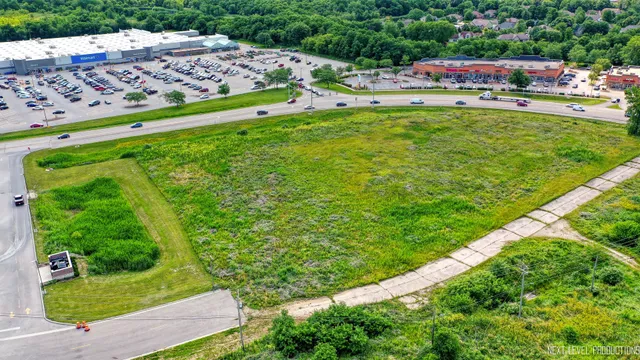 a view of yard with outdoor seating and green space