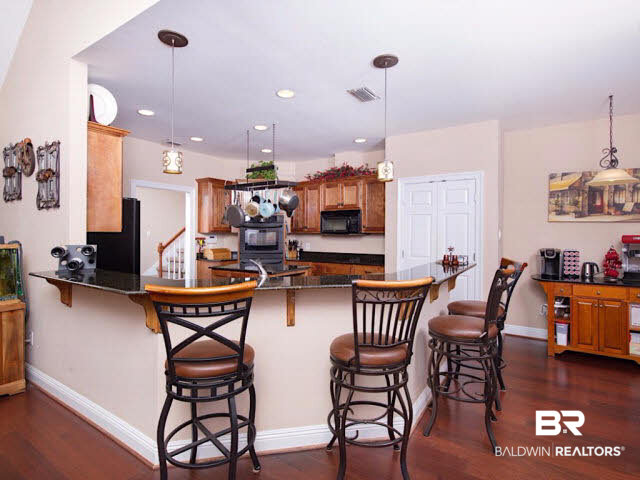 9380 Greenleaf Drive Daphne, AL 36527 - Photo 6 of 24 Gourmet Kitchen with breakfast bar, breakfast nook, cook top, double ovens, and tons of prep and storage space!