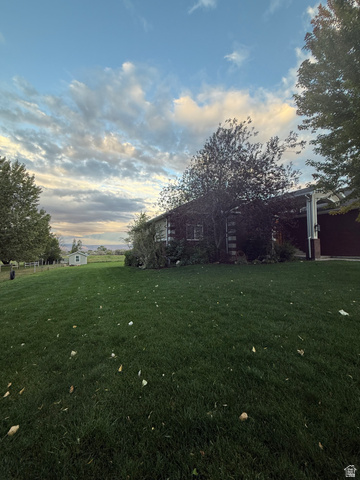 3145 South 500 West Vernal, UT 84078 - Photo 4 of 64 Yard at dusk with a yard