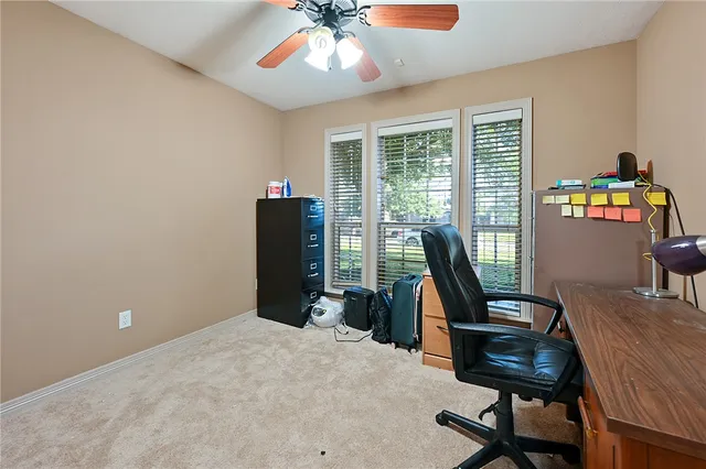 a workspace with furniture and a window