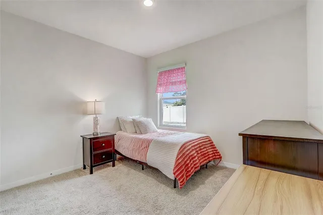 a living room with a bed and furniture