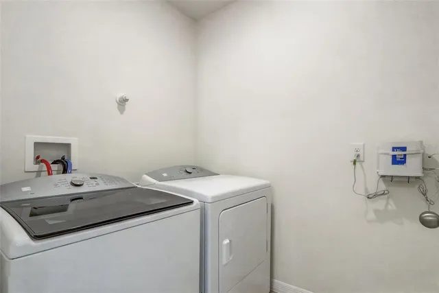 a view of a room with a window and chair