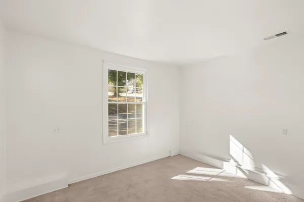 an empty room with windows