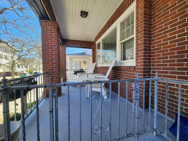 a balcony view with a sitting space