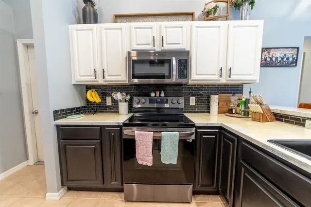 a bedroom with furniture and a flat screen tv