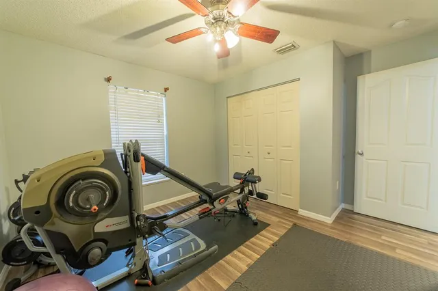 a bed sitting in a bedroom next to a window