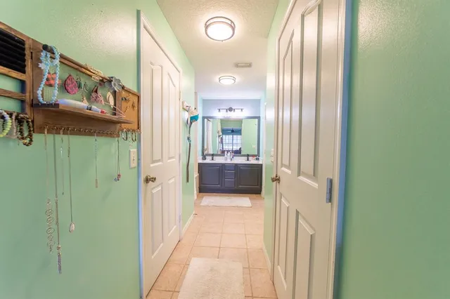 a white toilet sitting next to a sink