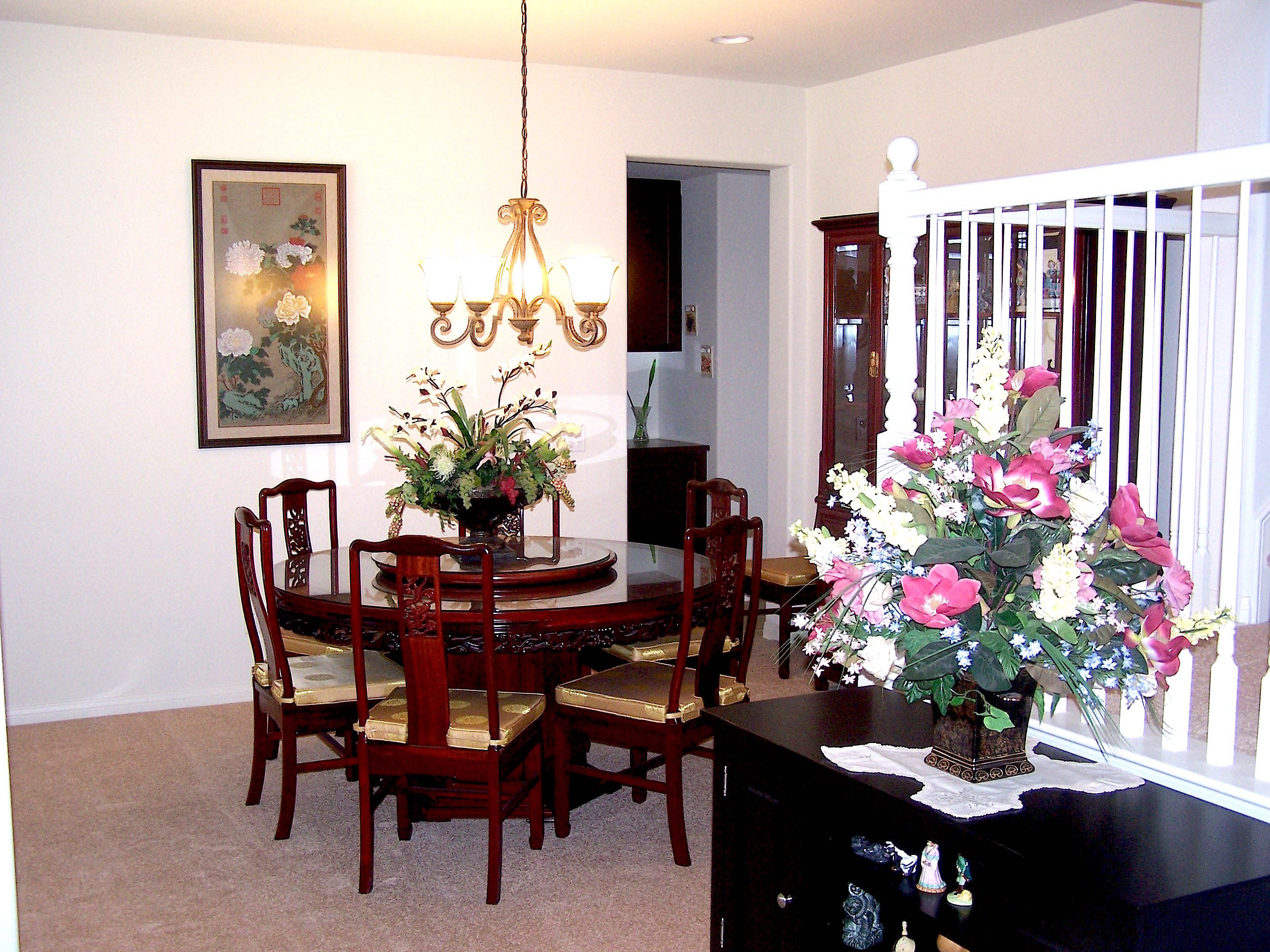 41713 Retsina Street Palmdale, CA 93551 - Photo 4 of 20 a view of a dining room with furniture and chandelier