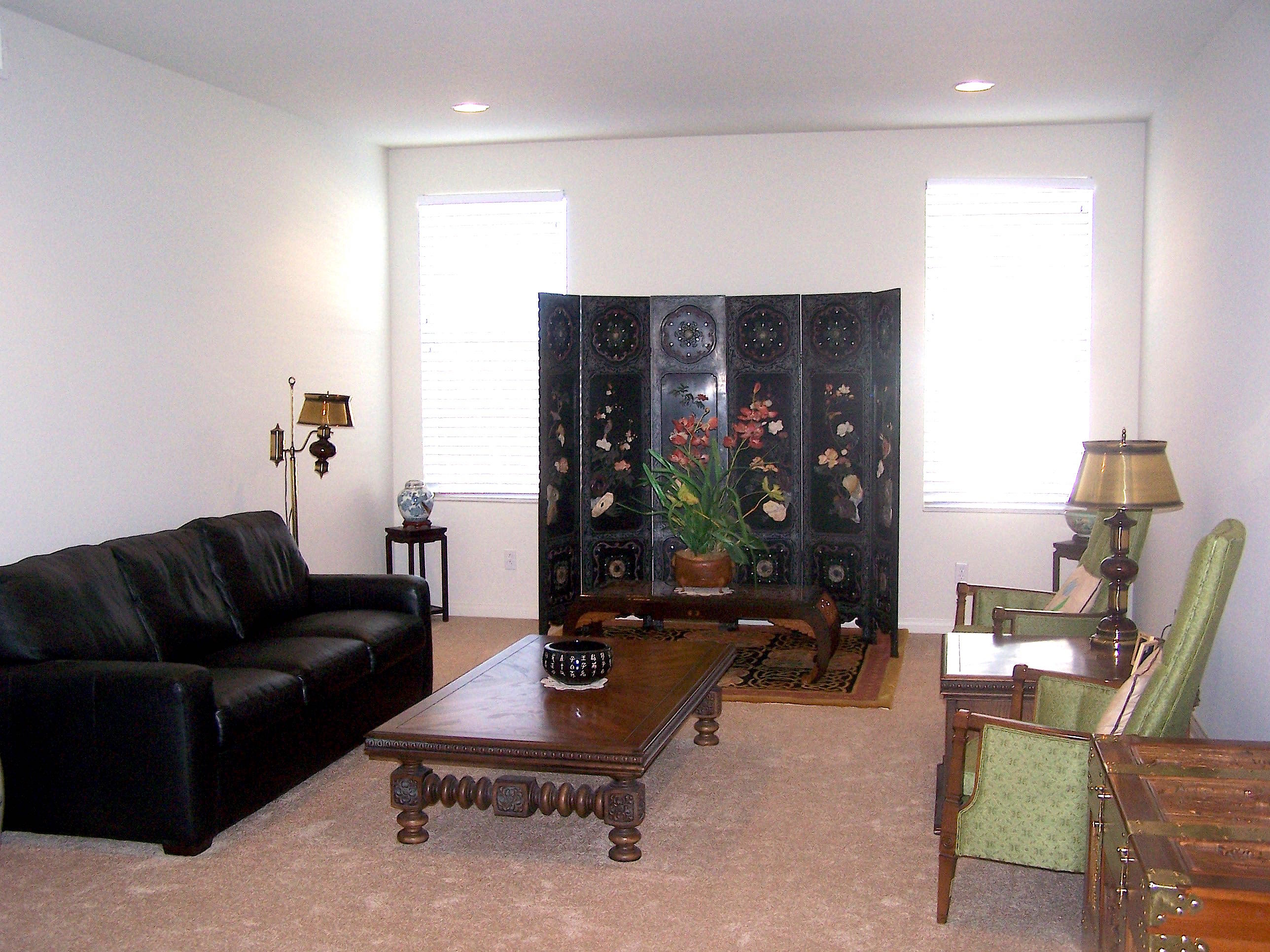 41713 Retsina Street Palmdale, CA 93551 - Photo 5 of 20 a living room with furniture gym equipment and a large window