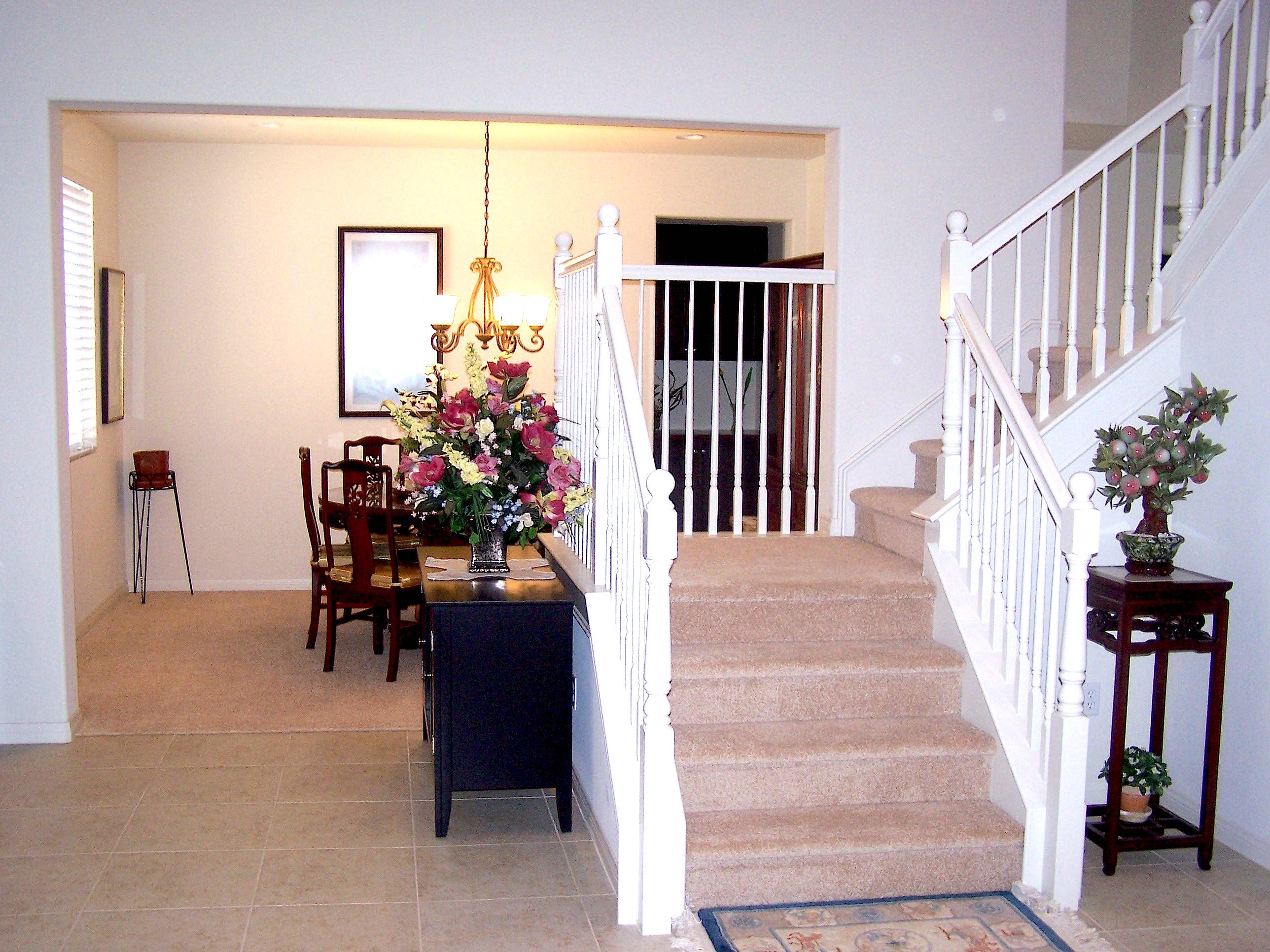 41713 Retsina Street Palmdale, CA 93551 - Photo 6 of 20 a view of entryway and hall with a dining room