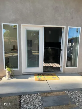 a view of swimming pool with glass door