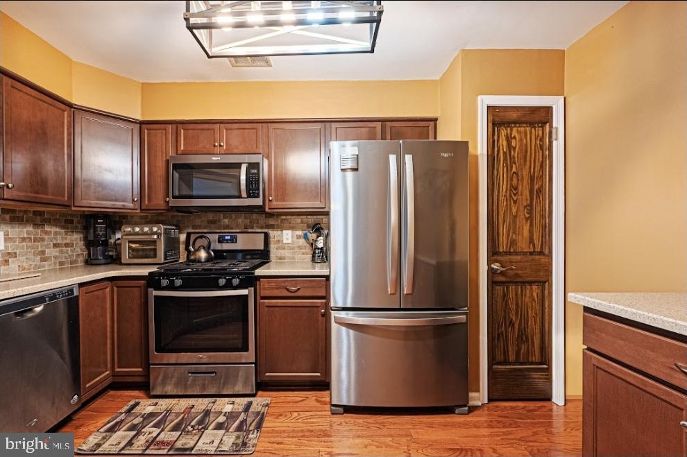 1202 Wharton Road Mount Laurel, NJ 08054 - Photo 14 of 31 a kitchen with a refrigerator sink and microwave