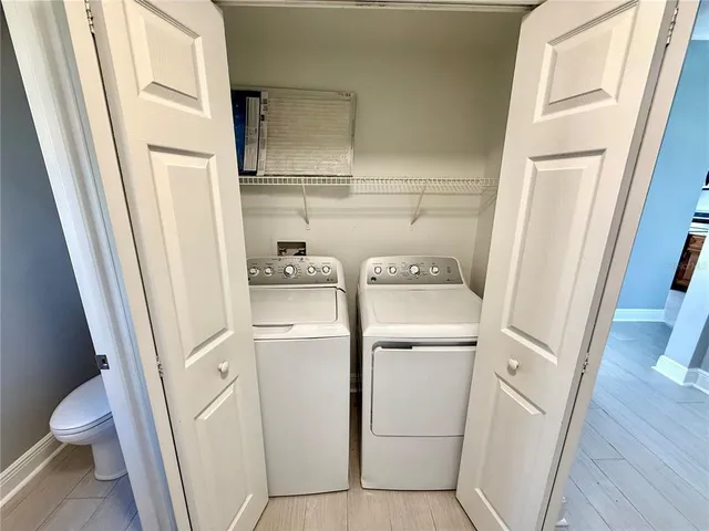 a utility room with dryer and washer