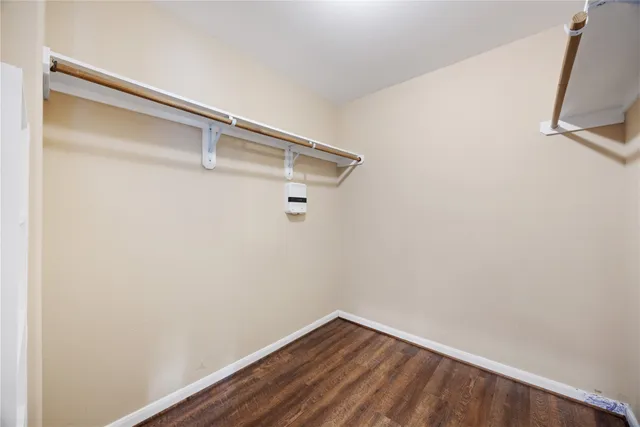 a view of a small space with wooden floor