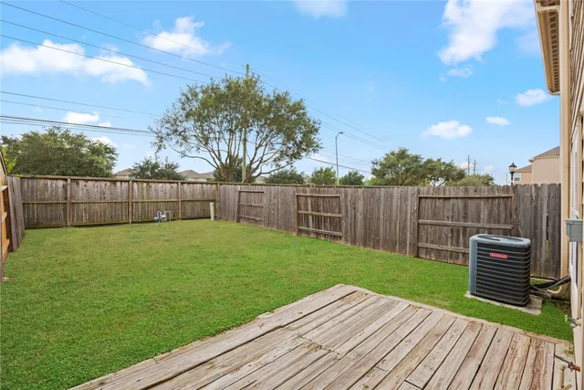 a view of a backyard with wooden floor