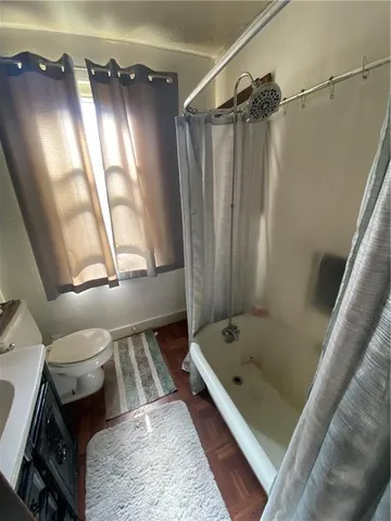 a bathroom with a tub and a shower