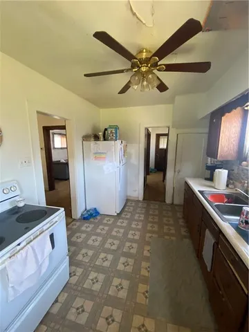 a living room with a bed and a dresser