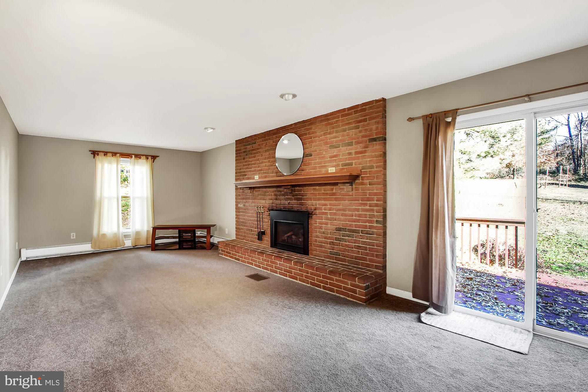 133 Risser Road Bainbridge, PA 17502 - Photo 5 of 20 Family room with gas fireplace and access to deck