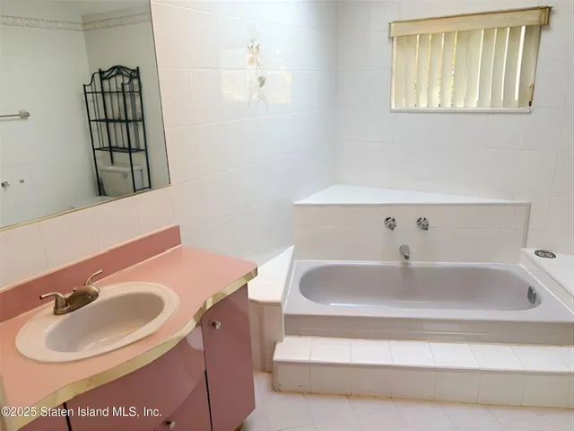 a bathroom with a sink and a bathtub