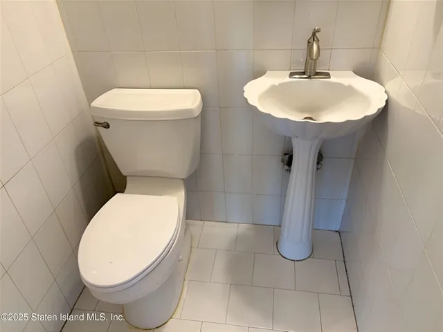 a bathroom with a toilet and a sink