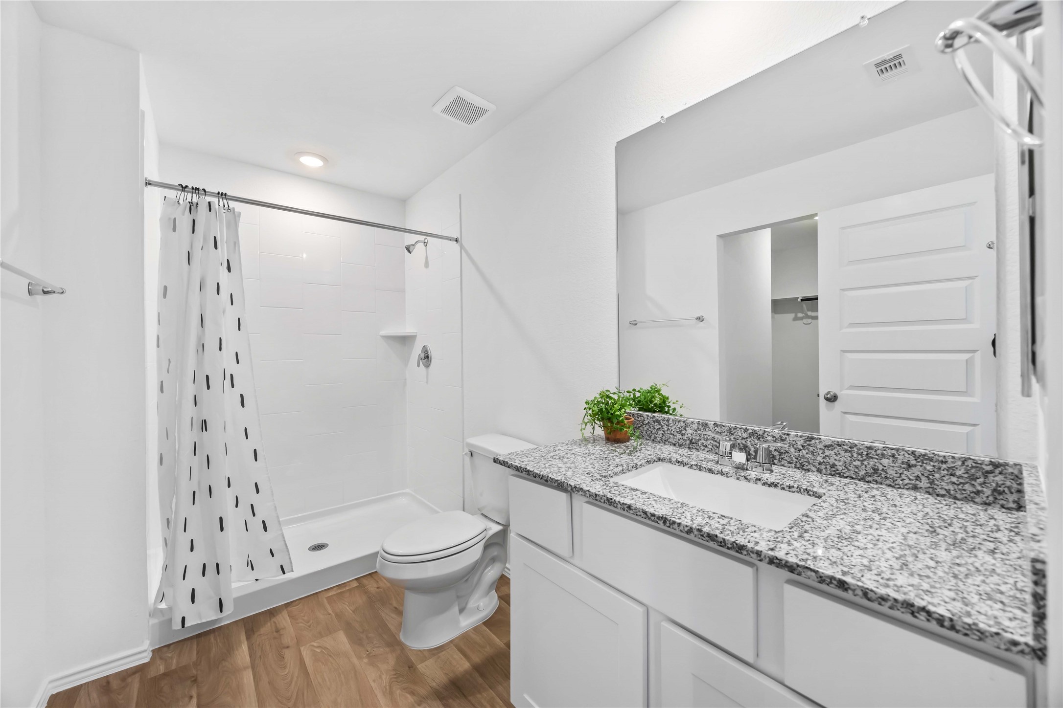 11910 Lilac Ice Lane Houston, TX 77048 - Photo 12 of 17 a bathroom with a granite countertop sink a toilet and shower