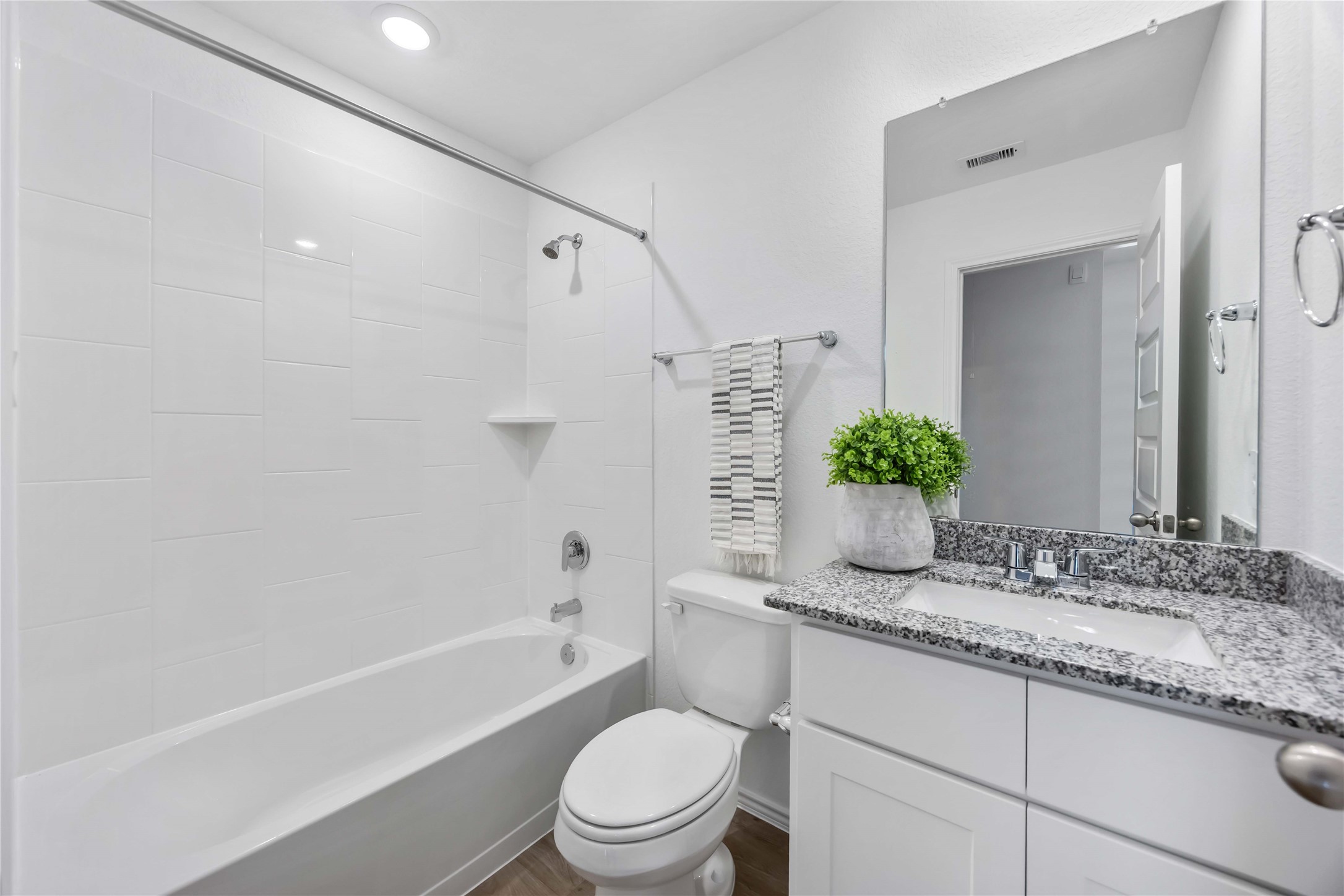 11910 Lilac Ice Lane Houston, TX 77048 - Photo 15 of 17 a bathroom with a granite countertop sink toilet and shower